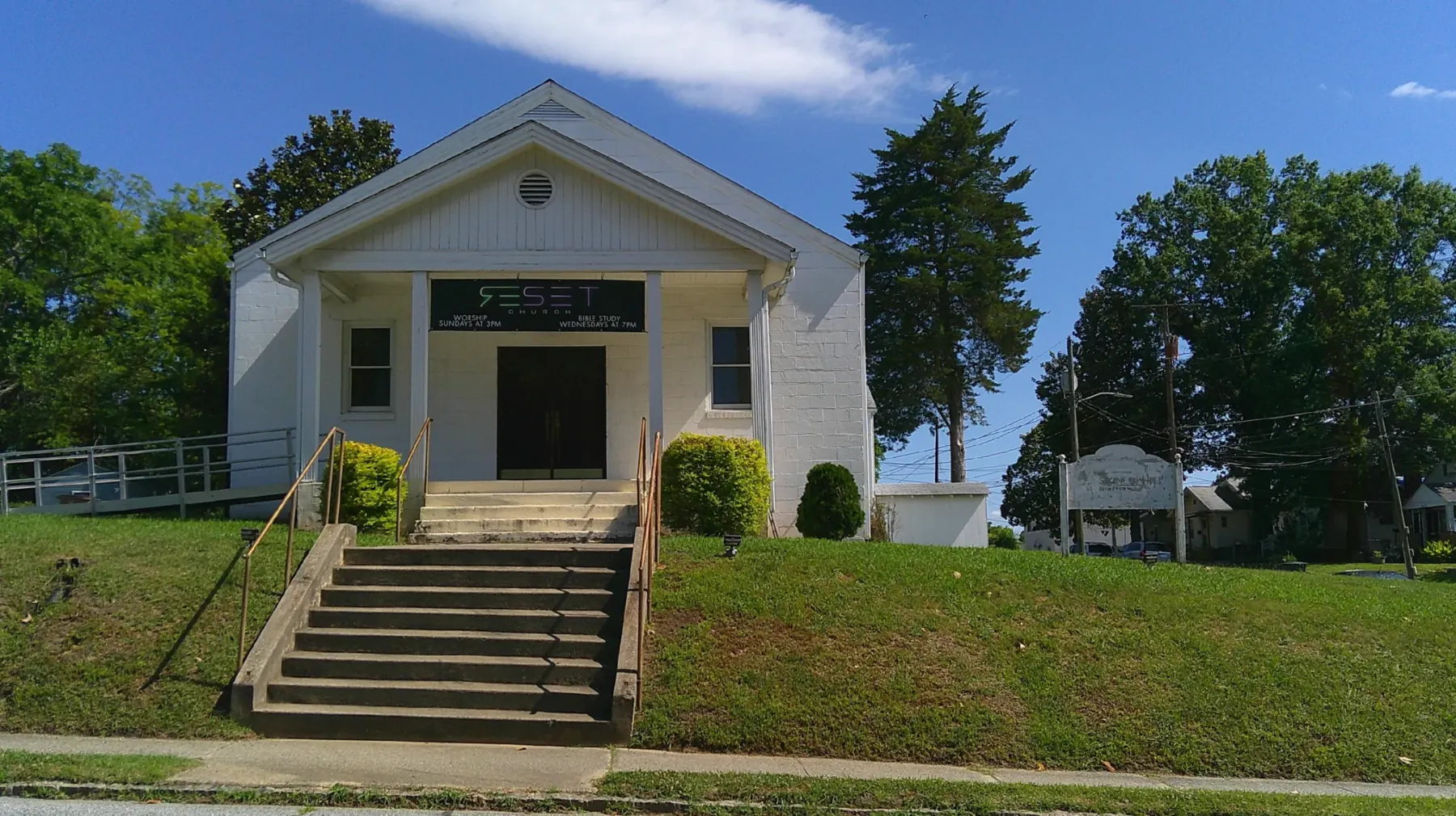 The historic Windsor Church, a white building with a columned entrance and wide front steps